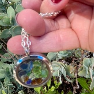 Silver sea glasss locket, outdoors