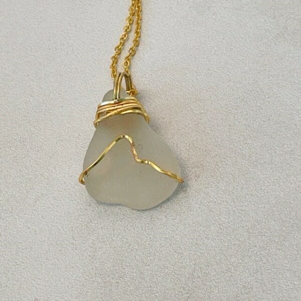 White sea glass necklace in gold