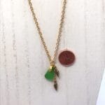 Green sea glass necklace with gold spindle shells - Image 2