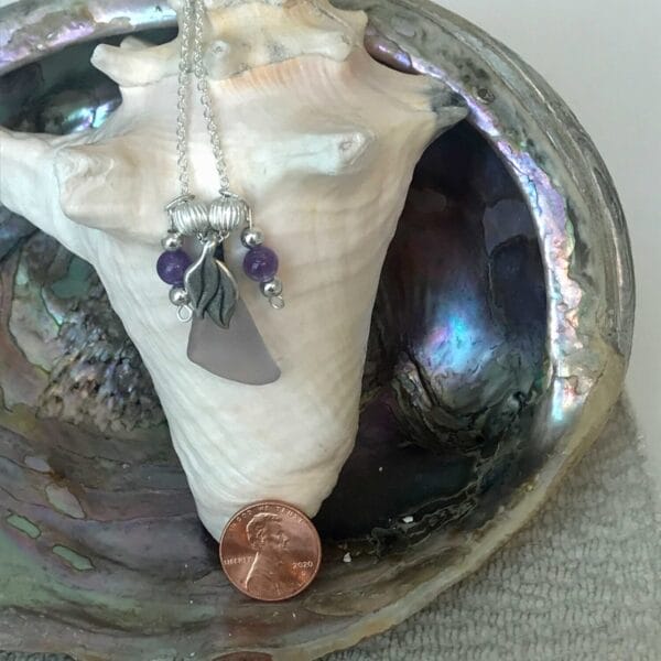 Lavender sea glass necklace on leaf bail