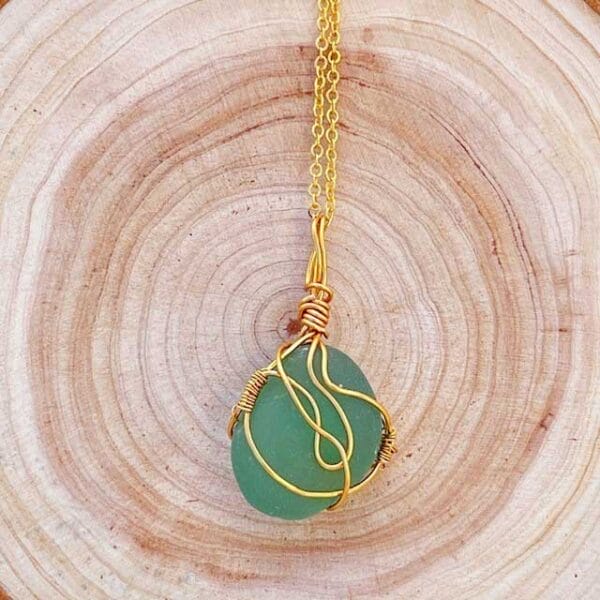 Green sea glass in gold necklace