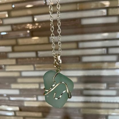 Turquoise sea glass necklace, silver swirl