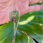 Pine cone sea glass necklace, with green monstera leaf