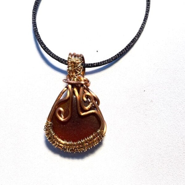 Brown wire wrapped sea glass