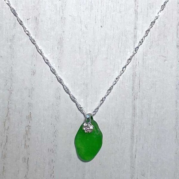 Emerald green sea glass with jeweled bail