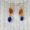 Blue and gold earrings, closer up