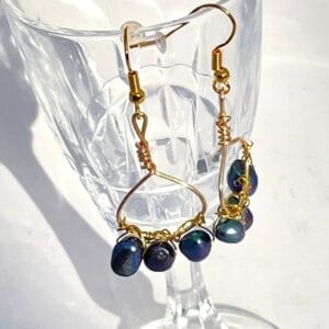 Peacock pearls on hoop earrings