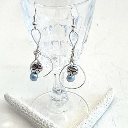 Silver earrings with blue pearl and flower