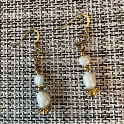 White and gold pearl earrings, view