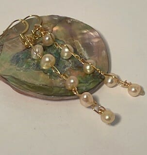 Gold dangling pearl earrings