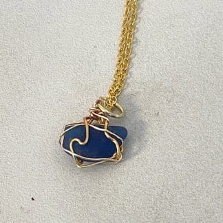 Blue sea glass with gold wire wrap necklace