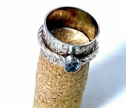Blue topaz spinner ring close up