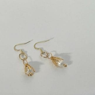 Gold capped pearl earrings