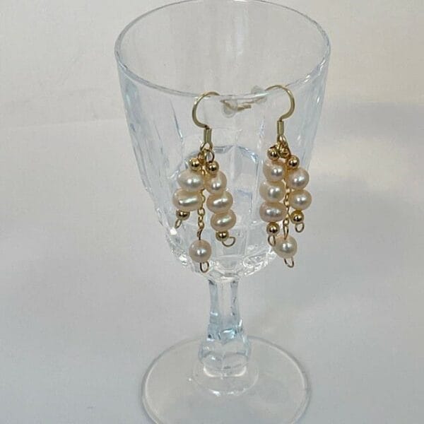 Dangling pearl earrings