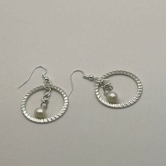 Pearls in textured circle earrings