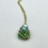 Green sea glass necklace with blue pearls