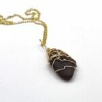 Brown sea glass in gold necklace