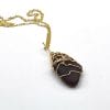 Brown sea glass in gold necklace