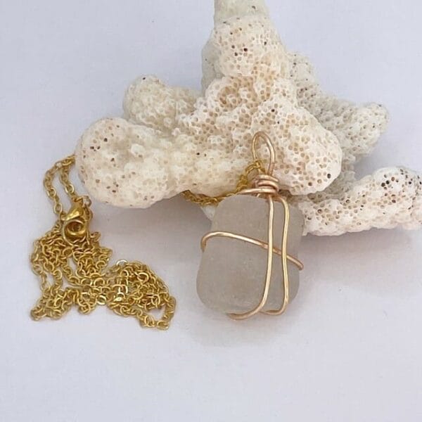 White sea glass in gold