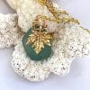 Teal sea glass necklace with leaf, close up
