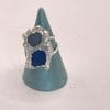 2 Shades of Blue sea glass ring on pedestal