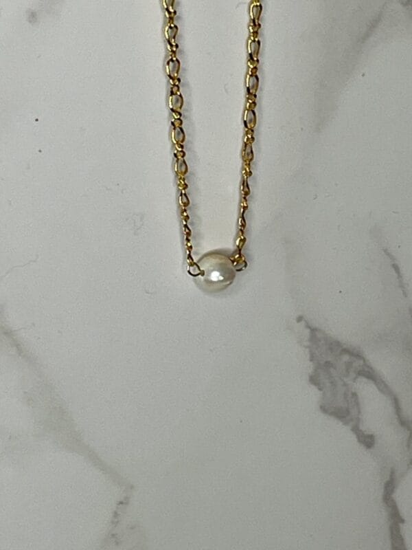 Pearaal necklace on gold chain