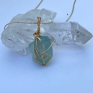 Gold wire wrapped teal sea glass necklace