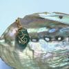 Oblong teal sea glass necklace, on abalone shell