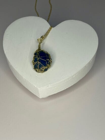 Blue sea glass crocheted necklace on heart