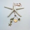 Pearl lariat with gold starfish, size