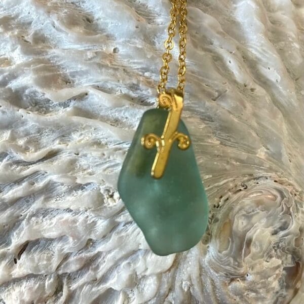 Aqua sea glass necklace on gold bail