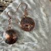 Copper heart dome earrings, close up