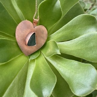 Copper heart green sea glass necklace, outdoors