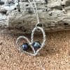 Sterling silver twisted heart necklace with pearls close up