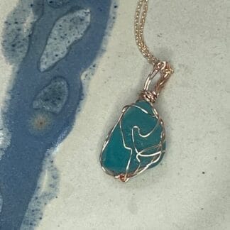 Light turquoise wire wrap sea glass necklace, front view