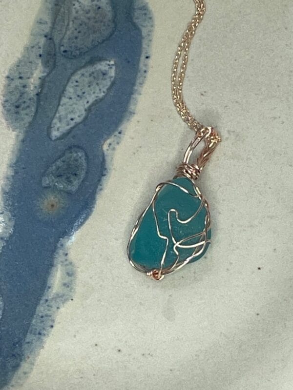 Light turquoise wire wrap sea glass necklace, front view