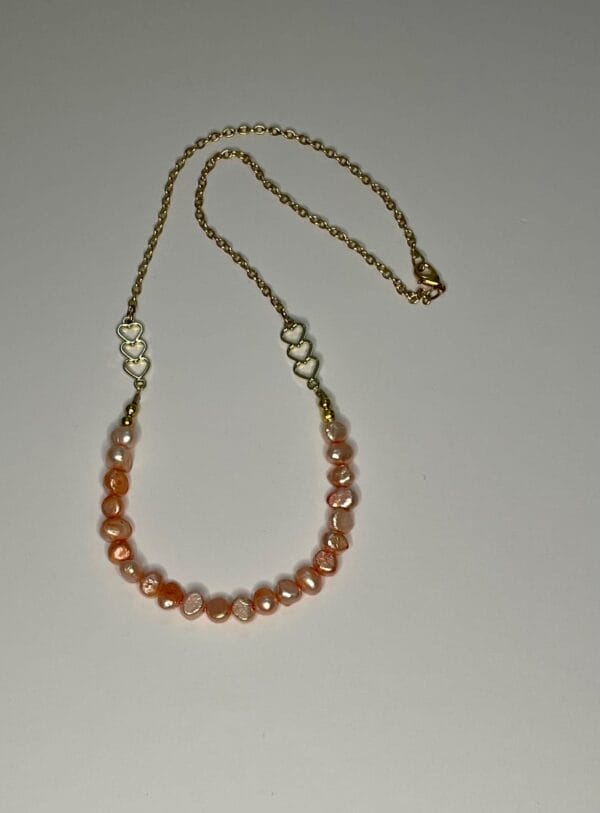 Peach pearl necklace, entire