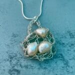 Light teal crocheted sea glass necklace with pearls,, close up