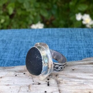 Black sea glass ring, side view