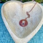 Copper disc necklace with lapis, top view