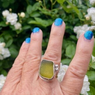 Green sea glass ring in gold, modeled