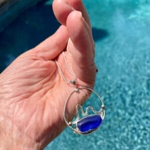 Blue sea glass in sterling silver wave circle necklace