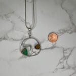 Silver wave necklace with teal and yellow sea glass, size