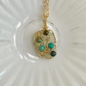 White sea glass necklace with gold crochet and turquoise, close up