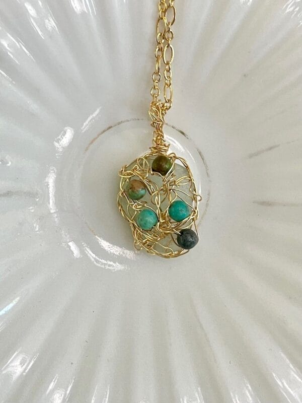 White sea glass necklace with gold crochet and turquoise, close up