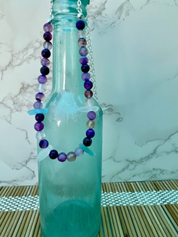 Aqua sea glass necklace with purple agate beads, hanging