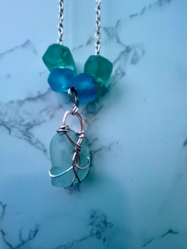 Aqua sea glass necklace with gold wire wrap