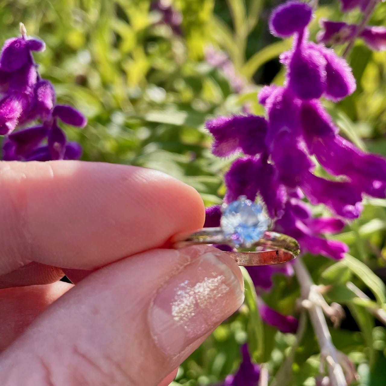 Aquamarine ring, held