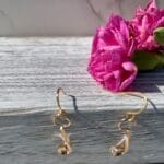 Gold twisted dangling earrings, hanging
